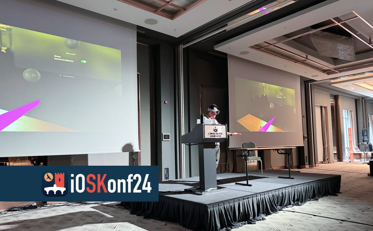 Showing the Vision Pro at a conference podium. Two huge displays behind me display AirPlay live stream